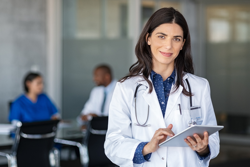 Ottawa-bioidentical-hormone-doctors-choosing-right-doctor Female bioidentical doctor holding tablet, with stethoscope around her neck